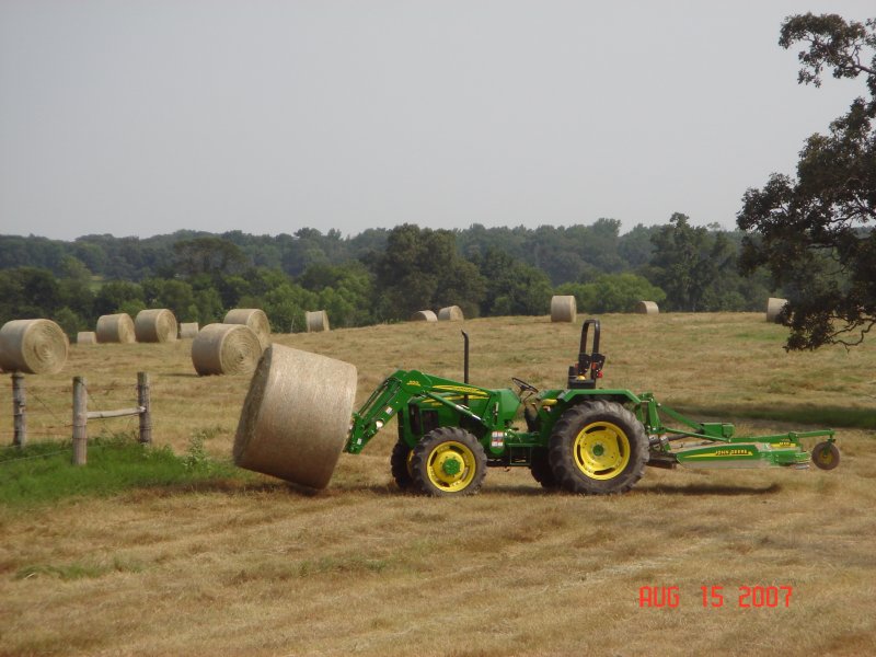 Cutting and rolling hay